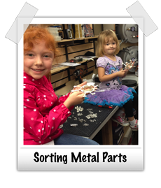 Molly and Madeline sorting metal